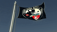 a black flag with the words groupe union defense paris on it