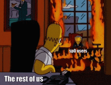 a cartoon of homer simpson sitting at a desk in front of a burning room with the words the rest of us