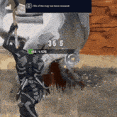 a skeleton is holding an axe in a video game while standing next to a large rock .