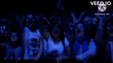 a crowd of people cheering with their hands in the air and the words veed.io on the bottom right