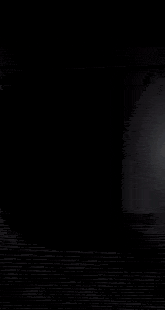 a blurred image of a light coming out of the dark