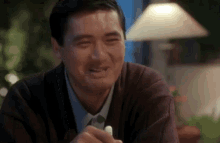 chow yun fat laughing hysterically fake laugh hiding