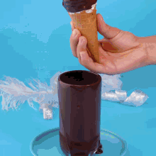 three ice cream cones with chocolate and sprinkles on top