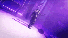 a man in a purple suit is dancing in a dark room .