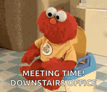elmo is sitting on a potty with the words meeting time downstairs office