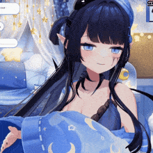 a girl with blue eyes and black hair is laying in a bed