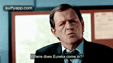 a man in a suit and tie asking where does eureka come in
