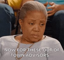 an elderly woman is sitting in a stadium and says now for these out of town advisors
