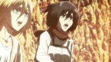 a couple of anime characters standing next to each other in front of a fire .