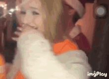 a close up of a woman 's face with the words imgplay in the corner