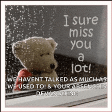 a teddy bear is looking out a window with a quote that says i sure miss you a lot