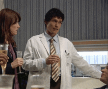 a man in a lab coat has a name tag that says ' dr ' on it