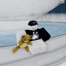 a roblox character is sitting next to a teddy bear and has the name grey on his head