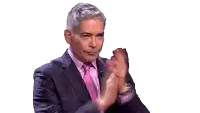 a man in a suit and tie is clapping his hands with the word bravo written below him