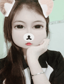 a girl with a teddy bear mask on her face looks at the camera