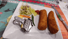 a plate of food on a table with a menu in the background that says bienvenue