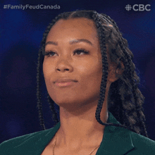 a close up of a woman 's face with the words family feud canada on the bottom right
