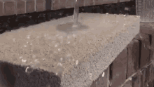 Water-resistant Brick GIF - Magic Spray Liquid Resistant Brick GIFs