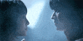 a man and a woman are looking into each others eyes