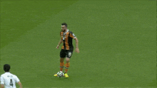 a blurry picture of a soccer game with a bet advertisement