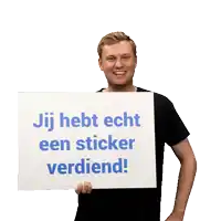 a man holds up a sign that says " hebt echt een sticker verdiend "
