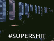 a group of people sitting in front of a computer screen with the hashtag #supershit on it