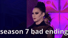 a drag queen is standing in front of a purple wall with the words season 7 bad ending written on it .