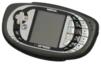 a nokia n gage cell phone with a soccer ball on the top