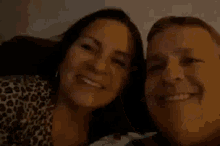 a man and woman are smiling for a picture together