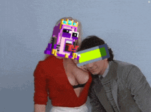 a man and a woman are posing for a picture and the woman has a pixelated face on her chest