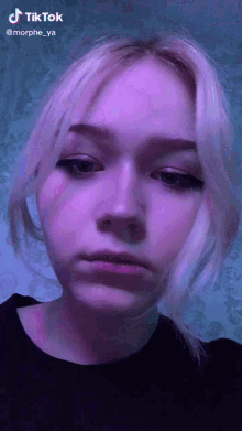 a close up of a woman 's face with a tiktok watermark on it