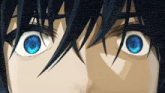 a close up of a person 's eyes with blue eyes and black hair .