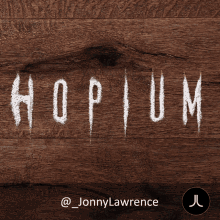 a wooden surface with the word hopium written in white chalk