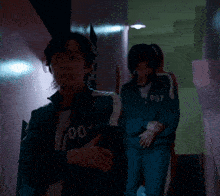 a woman in a blue jacket with the number 067 on it