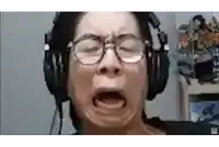 a woman wearing headphones is making a funny face .