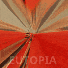 a blurred image of a woman running with utopia written on the bottom right