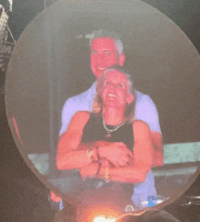 a man and a woman are dancing in a club