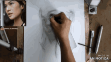 a person is drawing a woman 's face and the words made in animotica are on the bottom