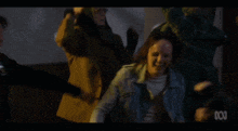 a group of people are dancing in a room with the abc logo on the bottom of the screen
