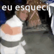 a man in a striped sweater is standing in front of a woman in a dress and the words `` eu esqueci '' .