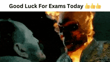 a poster that says good luck for exams today with a picture of a man on fire