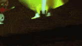a person is standing in front of a green and yellow light .
