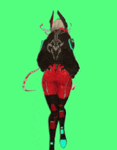 a woman in a black jacket and red pants is standing in front of a green background