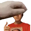 a man in a red shirt is giving a thumbs up while holding a picture .