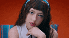a girl with a blue headband on her head