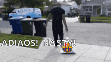 a man is carrying a bag with the fcb logo on it ..