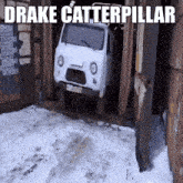 a white van is in a garage with drake clatterpillar written on the bottom