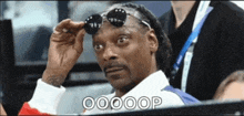 a man wearing sunglasses says oooop on the bottom right