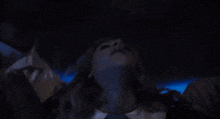 a blurry picture of a man and woman in a dark room