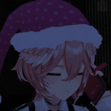 a girl wearing a santa hat is holding a book that says abc on it